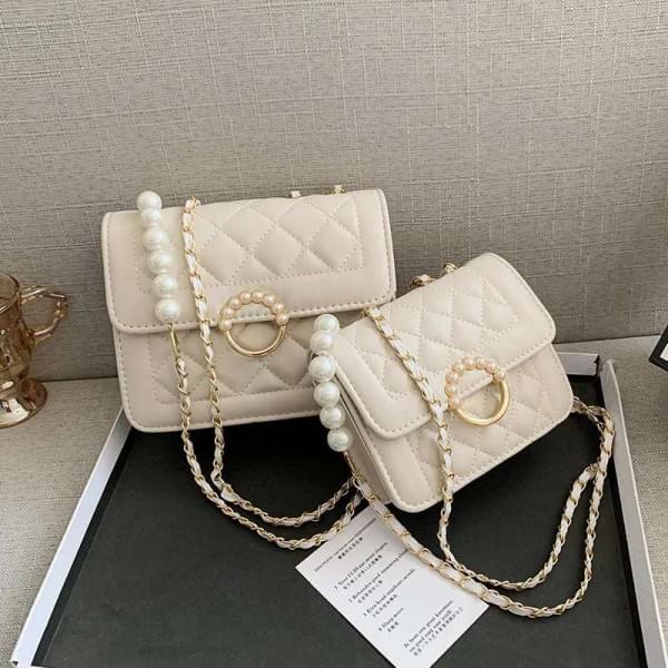 605664802_122112218223107836_1502652281149594560_n Glossy Pearl Bag - Image 1